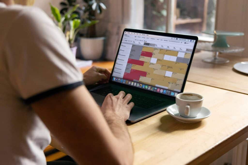 Vacation rental software user accessing their booking calendar on their laptop